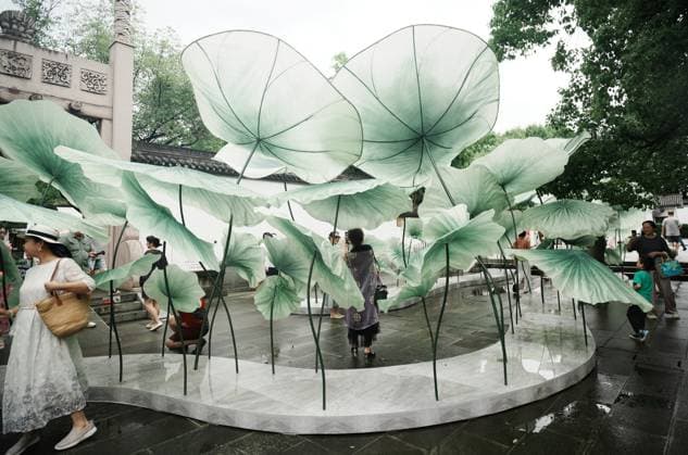 Lotus Leaf Art Installation Citizens enjoy the cool breeze under an art installation composed of giant lotus leaves in Hangzhou, Zhejiang Province, China on July 5, 2026. Hangzhou Zhejiang China  Copyright: xLWx i1783267417632