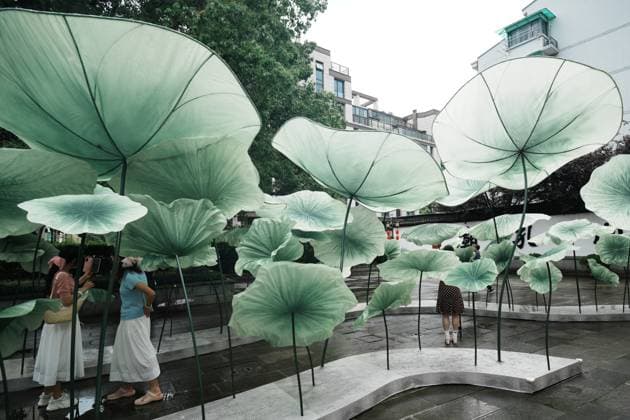 Lotus Leaf Art Installation Citizens enjoy the cool breeze under an art installation composed of giant lotus leaves in Hangzhou, Zhejiang Province, China on July 5, 2026. Hangzhou Zhejiang China  Copyright: xLWx i1783267420964