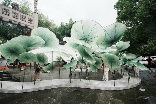 Lotus Leaf Art Installation Citizens enjoy the cool breeze under an art installation composed of giant lotus leaves in Hangzhou, Zhejiang Province, China on July 5, 2026. Hangzhou Zhejiang China  Copyright: xLWx i1783267421456