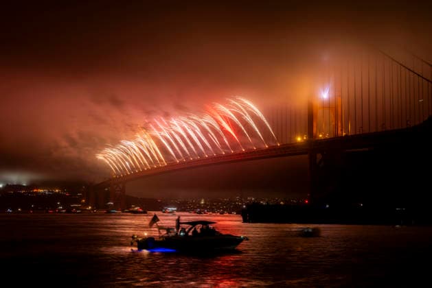 Spectators watch the fireworks display on the Golden Gate Bridge for the 250th anniversary of the United States from Horseshoe Bay in Sausalito, California on Saturday, July 4, 2026.  SFP20260704311 PETERxDASILVA