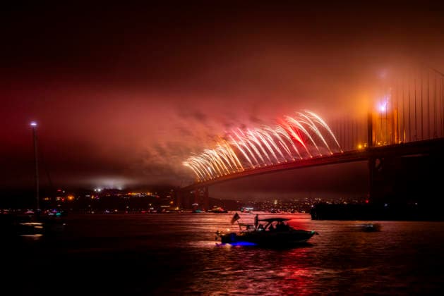 Spectators watch the fireworks display on the Golden Gate Bridge for the 250th anniversary of the United States from Horseshoe Bay in Sausalito, California on Saturday, July 4, 2026.  SFP20260704312 PETERxDASILVA