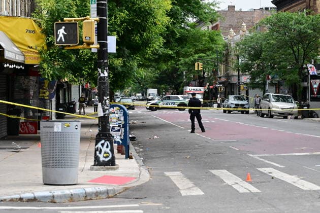 NYPD investigates shooting of officer in Brooklyn NEW YORK, UNITED STATES - JULY 5: Members of the NYPD crime scene unit process the scene where an NYPD officer was shot in the vest in the area of Nostrand Avenue and St. John’s Place in Brooklyn, New York, United States on July 5, 2026. Investigators with the NYPD Crime Scene Unit, detectives and the Force Investigation Division are staged in the area processing the scene. Ballistic damage to an unmarked NYPD vehicle that officers were sitting in was seen at the scene which had bullet holes in the front and rear windshield and the passenger side of the car. Numerous evidence markers were seen scattered at the crime scene. Kyle Mazza Anadolu New York United States. Editorial use only. Plea  Copyright: x2026xAnadoluxKylexMazzax