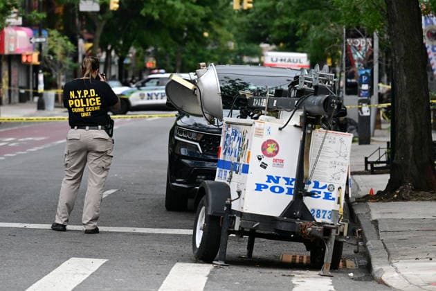 NYPD investigates shooting of officer in Brooklyn NEW YORK, UNITED STATES - JULY 5: Members of the NYPD crime scene unit process the scene where an NYPD officer was shot in the vest in the area of Nostrand Avenue and St. John’s Place in Brooklyn, New York, United States on July 5, 2026. Investigators with the NYPD Crime Scene Unit, detectives and the Force Investigation Division are staged in the area processing the scene. Ballistic damage to an unmarked NYPD vehicle that officers were sitting in was seen at the scene which had bullet holes in the front and rear windshield and the passenger side of the car. Numerous evidence markers were seen scattered at the crime scene. Kyle Mazza Anadolu New York United States. Editorial use only. Plea  Copyright: x2026xAnadoluxKylexMazzax
