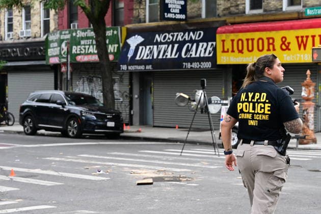 NYPD investigates shooting of officer in Brooklyn NEW YORK, UNITED STATES - JULY 5: Members of the NYPD crime scene unit process the scene where an NYPD officer was shot in the vest in the area of Nostrand Avenue and St. John’s Place in Brooklyn, New York, United States on July 5, 2026. Investigators with the NYPD Crime Scene Unit, detectives and the Force Investigation Division are staged in the area processing the scene. Ballistic damage to an unmarked NYPD vehicle that officers were sitting in was seen at the scene which had bullet holes in the front and rear windshield and the passenger side of the car. Numerous evidence markers were seen scattered at the crime scene. Kyle Mazza Anadolu New York United States. Editorial use only. Plea  Copyright: x2026xAnadoluxKylexMazzax