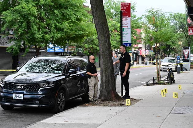 NYPD investigates shooting of officer in Brooklyn NEW YORK, UNITED STATES - JULY 5: Members of the NYPD crime scene unit process the scene where an NYPD officer was shot in the vest in the area of Nostrand Avenue and St. John’s Place in Brooklyn, New York, United States on July 5, 2026. Investigators with the NYPD Crime Scene Unit, detectives and the Force Investigation Division are staged in the area processing the scene. Ballistic damage to an unmarked NYPD vehicle that officers were sitting in was seen at the scene which had bullet holes in the front and rear windshield and the passenger side of the car. Numerous evidence markers were seen scattered at the crime scene. Kyle Mazza Anadolu New York United States. Editorial use only. Plea  Copyright: x2026xAnadoluxKylexMazzax