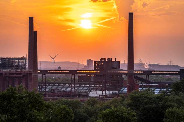 Sunset over the coking plant at the Zollverein Coal Mine Industrial Complex, a UNESCO World Heritage Site; chimneys and truss bridges, Essen; tetrahedron on the Beckstraße slag heap in Bottrop; wind turbine in Essen’s city harbor; gasometer at the active Prosper coking plant, North Rhine-Westphalia, Germany; Zollverein Coal Mine Industrial Complex