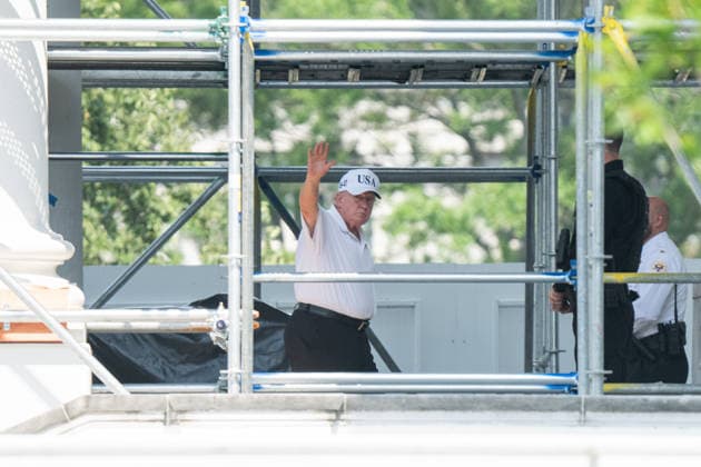 President Donald Trump waves as he returns to the White House in Washington DC on Sunday, July 5, 2026.  WAX20260704905 AaronxSchwartz