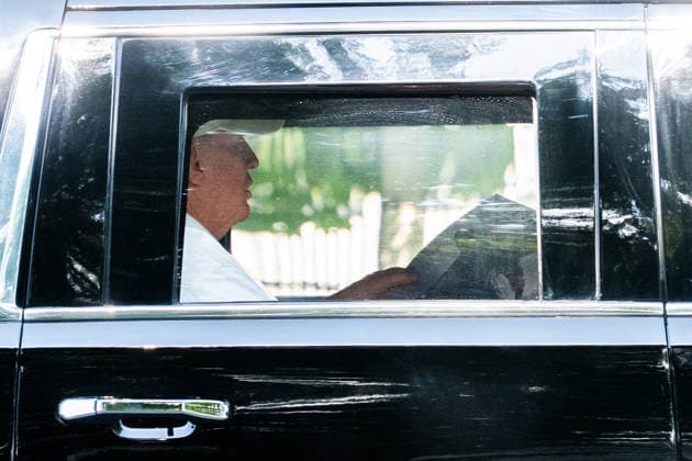 President Donald J Trump holds a display of President Volodymyr Zelenskyy of Ukraine with the text let him cook as he returns to the White House in Washington DC on Sunday, July 5, 2026.  WAX20260705902 AaronxSchwartz