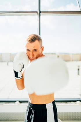 Portrait of boxer boxing at the window model released, Symbolfoto, OCMF00131