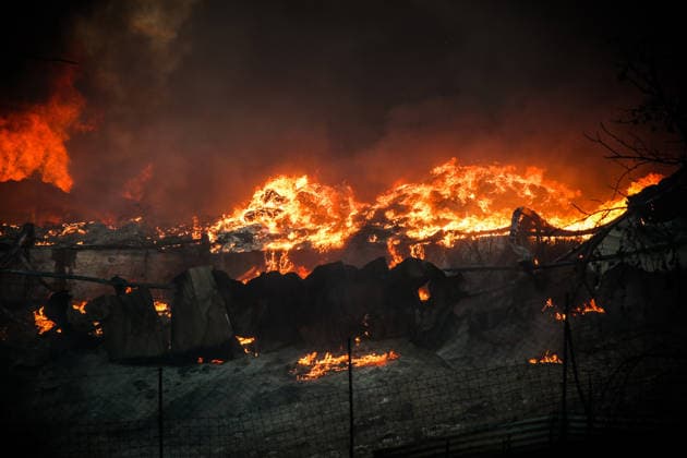 (260706) -- THESSALONIKI, July 6, 2026 -- Huge smoke rises from a wildfire on the outskirts of Thessaloniki, Greece, July 5, 2026. Greece s second-largest city, Thessaloniki, was blanketed by toxic smoke on Sunday after a wildfire set two factories ablaze on its outskirts, the Greek Fire Service said. (Photo by Xinhua) GREECE-THESSALONIKI-WILDFIRE VasilisxVerveridis 