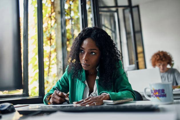 Businesswoman using graphics tablet at desk in office model released, Symbolfoto property released, ZEDF02804
