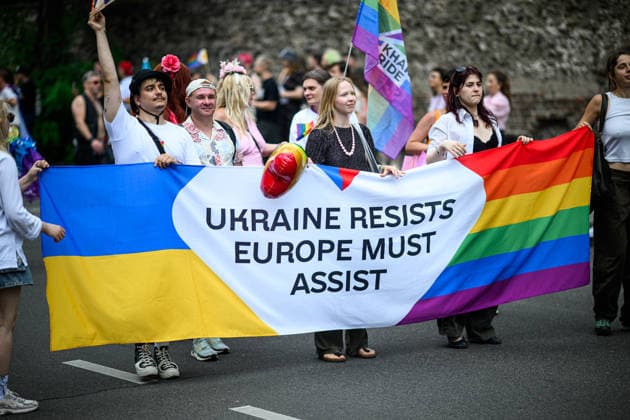 COLOGNE, GERMANY - 5 JULY, 2026: Pride parade participants carry a Ukraine and rainbow banner reading Ukraine resists Europe must assist. Street Parade of the Christopher Street Day (CSD), Gay Pride. LGBT  Copyright: xx