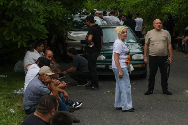 ARMENIA, KOTAYK PROVINCE - JULY 6, 2026: Citizens crowd outside the home of Gagik Tsarukyan, Chairman of Prosperous Armenia, in the village of Arinj, northeast of Yerevan. According to his spokeswoman, searches occur across almost all of the offices of companies owned by Tsarukyan s Multi Group Concern Armenia  - ZUMAt113 20260706_zaa_t113_431 Copyright: xAlexanderxPatrinx