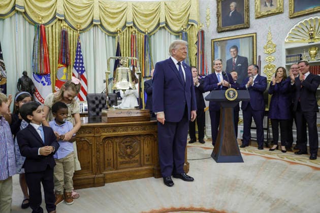 US President Donald Trump smiles after ringing the opening bell of the Nasdaq and the New York Stock Exchange (NYSE) to celebrate the first day of trading for Trump Accounts in the Oval Office of the White House in Washington, DC on Tuesday, July 6, 2026. Trump Accounts grant eligible US children born between 2026 and 2028 $1000.00 to fund starter IRAs.  WASP20260706106 SHAWNxTHEW