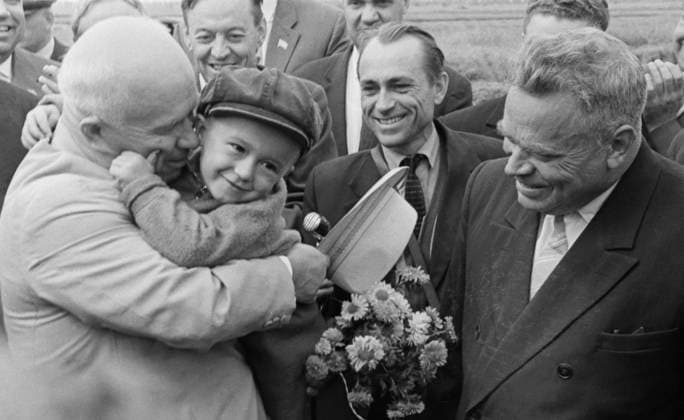KRASNODAR TERRITORY, USSR. September 1, 1963. Nikita Khrushchev hugs a child at the meeting with workers of Krasnoarmeisky rice state farm. Alexey Stuzhin, Eugene Shulepov TASS  19331598