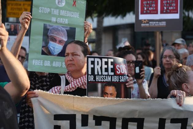 Protest in Tel Aviv Calls for Release of Palestinian Doctor Hussam Abu Safiya TEL AVIV, ISRAEL JULY 6, 2026: Demonstrators gather outside the Government Complex at Kaplan Street in Tel Aviv to demand the immediate release of Palestinian doctor Hussam Abu Safiya. Protesters carried banners and placards calling for his release, expressing concern over his reported detention conditions, and urging protection for medical personnel and political prisoners. The demonstration was held in response to claims by supporters and his legal representative regarding his treatment while in detention. Tel Aviv Israel Copyright: x xSaeedxQaqx xJNAxPressx