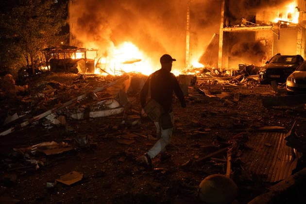 RECORD DATE NOT STATED Cars burn following a massive combined Russian attack, Kyiv, Ukraine, on July 6, 2026. Russian forces launched a large-scale attack on the capital using ballistic and cruise missiles as well as attack drones, causing destruction to apartment buildings and civilian infrastructure across several districts of the city. The Podilskyi district suffered the most severe damage. At least 11 people were killed and 46 others were injured (Photo by Danylo Antoniuk Ukrinform) Russia launches another massive strike on Kyiv  Copyright: xDanyloxAntoniukx