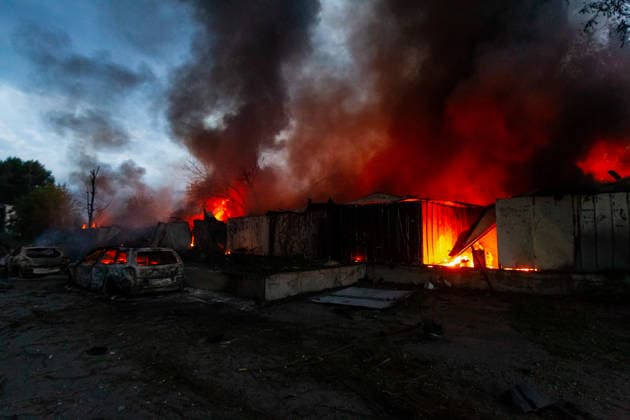 RECORD DATE NOT STATED Cars destroyed in a massive combined Russian attack stand near burning garages in Kyiv, Ukraine, on July 6, 2026. Russian forces launched a large-scale attack on the capital using ballistic and cruise missiles, as well as attack drones, causing extensive damage to residential buildings and civilian infrastructure in several districts of the city. The Podilskyi district was hit the hardest. At least 11 people were killed and 46 others were injured (Photo by Kyrylo Chubotin Ukrinform) Russia launches another massive strike on Kyiv  Copyright: xKyryloxChubotinx