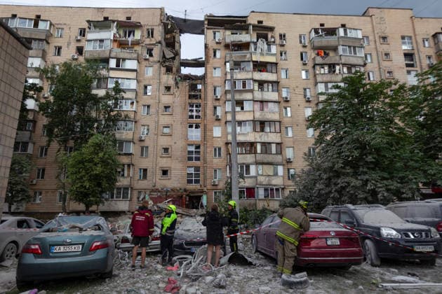 Russian missile hits apartment building in Kyiv™s Podilskyi district Rescuers stand outside a nine-storey residential building damaged in a massive combined Russian attack in Kyiv™s Podilskyi district, Ukraine, on July 6, 2026. Russian forces launched a large-scale attack on the capital using ballistic and cruise missiles as well as attack drones, causing destruction to apartment buildings and civilian infrastructure across several districts of the city. The Podilskyi district suffered the most severe damage. At least 11 people were killed and 46 others were injured, Credit:Kyrylo Chubotin Ukrinform Avalon Ukraine, Kyiv  Copyright: xKyryloxChubotinx xUkrinformx xAvalonx 1114838999