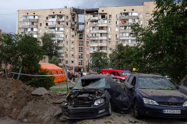 Russian missile hits apartment building in Kyiv™s Podilskyi district Damaged cars stand beside a crater in front of a nine-storey residential building damaged in a massive combined Russian attack in Kyiv™s Podilskyi district, Ukraine, on July 6, 2026. Russian forces launched a large-scale attack on the capital using ballistic and cruise missiles as well as attack drones, causing destruction to apartment buildings and civilian infrastructure across several districts of the city. The Podilskyi district suffered the most severe damage. At least 11 people were killed and 46 others were injured, Credit:Kyrylo Chubotin Ukrinform Avalon Ukraine, Kyiv  Copyright: xKyryloxChubotinx xUkrinformx xAvalonx 1114839020