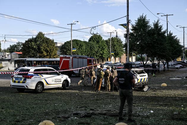 RECORD DATE NOT STATED Explosive ordnance disposal specialists stand near a police car damaged in a Russian guided bomb attack in Zaporizhzhia, Ukraine, on July 5, 2026. Russian forces struck the city with two guided aerial bombs. One bomb hit near a multi-storey residential building, while the other struck a private residential area. The attack damaged 35 apartments in the apartment building and destroyed private homes. More than ten people were injured, and a police officer was killed (Photo by Dmytro Smolienko Ukrinform) Russian forces strike Zaporizhzhia with two guided bombs  Copyright: xDmytroxSmolienkox