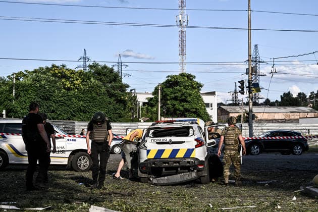 RECORD DATE NOT STATED A police car damaged in a Russian guided bomb attack stands near a five-storey residential building in Zaporizhzhia, Ukraine, on July 5, 2026. Russian forces struck the city with two guided aerial bombs. One bomb hit near a multi-storey residential building, while the other struck a private residential area. The attack damaged 35 apartments in the apartment building and destroyed private homes. More than ten people were injured, and a police officer was killed (Photo by Dmytro Smolienko Ukrinform) Russian forces strike Zaporizhzhia with two guided bombs  Copyright: xDmytroxSmolienkox