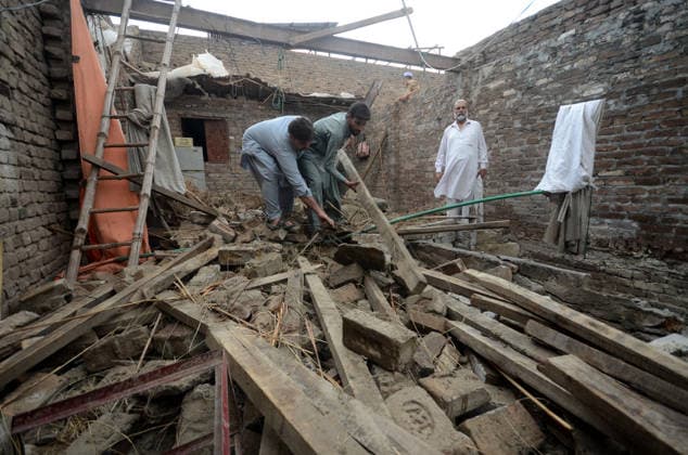 July 6, 2026, Peshawar, Peshawar, Pakistan: Severe Storm and Heavy Rain Lash Peshawar, Leaving Widespread Damage and Multiple Injuries..Peshawar, Pakistan, July, 06: Torrential rain and a powerful windstorm caused widespread destruction across Peshawar, uprooting trees, damaging homes, and flooding major roads. In one incident, the collapse of a house roof left four women and several children seriously injured. Streets in several areas were submerged, resembling ponds and disrupting daily life as rescue and emergency teams responded to the affected locations. Peshawar Pakistan  - ZUMAa217 20260706_znp_a217_018 Copyright: xHussainxAlix