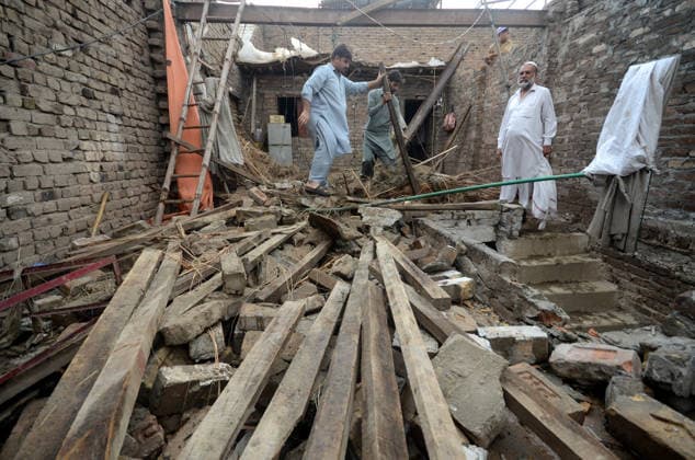 July 6, 2026, Peshawar, Peshawar, Pakistan: Severe Storm and Heavy Rain Lash Peshawar, Leaving Widespread Damage and Multiple Injuries..Peshawar, Pakistan, July, 06: Torrential rain and a powerful windstorm caused widespread destruction across Peshawar, uprooting trees, damaging homes, and flooding major roads. In one incident, the collapse of a house roof left four women and several children seriously injured. Streets in several areas were submerged, resembling ponds and disrupting daily life as rescue and emergency teams responded to the affected locations. Peshawar Pakistan  - ZUMAa217 20260706_znp_a217_023 Copyright: xHussainxAlix