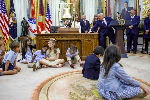 Children sit on the floor as US President Donald J. Trump (not pictured) speaks on the first day of trading for Trump Accounts in the Oval Office of the White House in Washington, DC, USA, 06 July 2026. Trump Accounts grant eligible US children born between 2026 and 2028 $1000.00 to fund ‘starter’ IRAs. Copyright: xShawnxThewx xPoolxviaxCNPx MediaPunchx