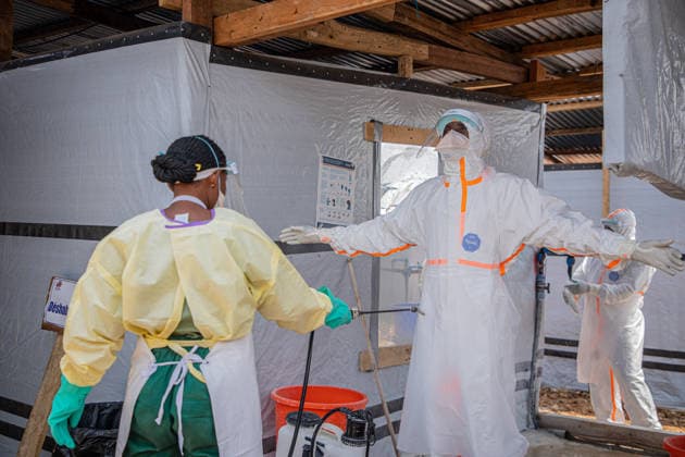 (260706) -- BUNIA, July 6, 2026 -- Medical workers carry out disinfection work at an Ebola treatment center in Bunia, the capital of Ituri Province in the Democratic Republic of the Congo, July 6, 2026. The death toll from the latest Ebola outbreak in the Democratic Republic of the Congo has surpassed 500, according to a report released Sunday by the country s health authorities. DR CONGO-BUNIA-EBOLA OUTBREAK-DEATH XinxHuashefa 
