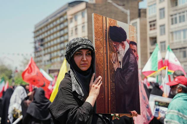 Tehran Funeral Procession For Khamenei A mourner holds a portrait of Iran s slain supreme leader Ayatollah Ali Khamenei as people attend the funeral procession of him and his family members in Tehran on July 6, 2026. Vast crowds gathered for the funeral procession of Iran s slain supreme leader Ali Khamenei in Tehran on July 6, with authorities estimating millions were on the streets in numbers that could rival those of his predecessor s farewell nearly four decades ago. Tehran Tehran Iran Copyright: xArezoox