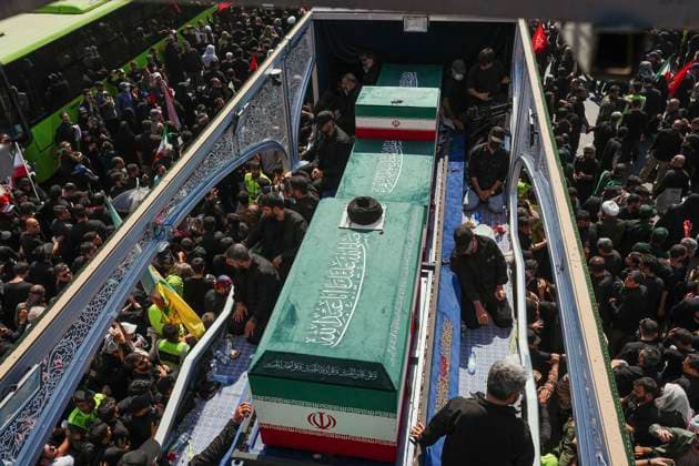 Tehran Funeral Procession For Khamenei Crowds of mourners surround the convoy carrying the coffins of Iran s slain supreme leader Ali Khamenei and members of his family during a funeral procession near Azadi Square in Tehran on July 6, 2026. Vast crowds gathered for the funeral procession of Iran s slain supreme leader Ali Khamenei in Tehran on July 6, with authorities estimating millions were on the streets in numbers that could rival those of his predecessor s farewell nearly four decades ago. Tehran Tehran Iran Copyright: xArezoox