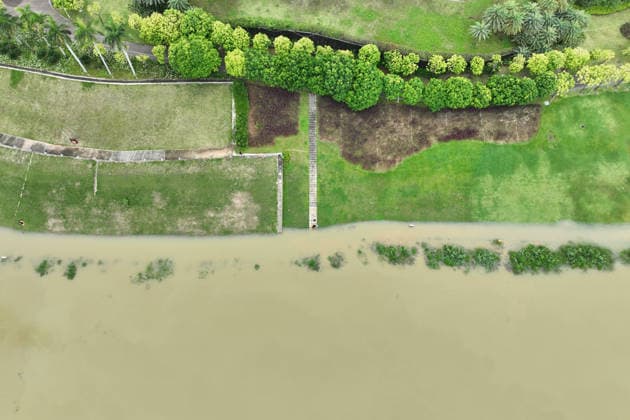 NANNING, CHINA - JULY 06: Aerial view of riverside walkways submerged in flood water on July 6, 2026 in Nanning, Guangxi Zhuang Autonomous Region of China. Local authorities launched a Level-IV flood emergency response as the river exceeded warning levels following heavy rainfall brought by typhoon Maysak.  Copyright: xChinaxNewsxServicex 111652649516