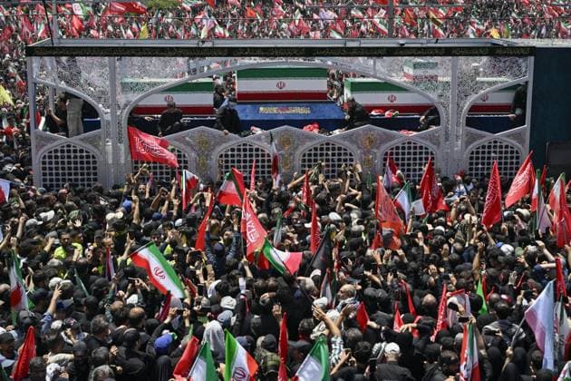 Funeral for Iran s ex-leader Khamenei A truck carrying late Iranian Supreme Leader Ayatollah Ali Khamenei s coffin crawls through crowds in a funeral procession in Tehran, Iran, on July 6, 2026, following his death in Israeli and U.S. airstrikes in February.  A14AA0005621973P