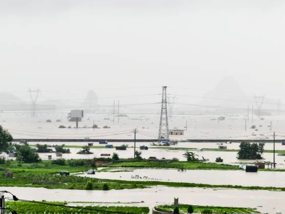 NANNING, CHINA - JULY 07: Floodwaters submerge villages and farmlands with only the tops of jasmine planting sheds visible after typhoon Maysak on July 7, 2026 in Hengzhou, Nanning, Guangxi Zhuang Autonomous Region of China. Local authorities are organizing the evacuation of residents in affected areas of Hengzhou City in Guangxi.  Copyright: xVCGx 111652794686