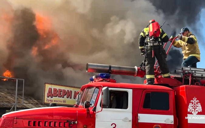 RUSSIA, IZHEVSK - JULY 7, 2026: Firefighters battle a fire at a warehouse distribution center. Video grab. Best quality available. Russia Emergencies Ministry TASS  94776609