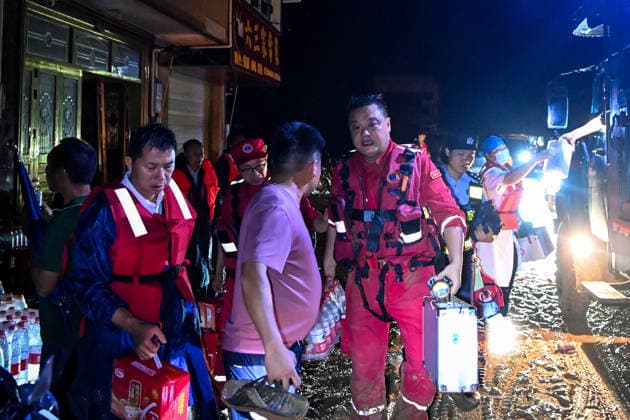 (260707) -- HENGZHOU, July 7, 2026 -- Rescuers are pictured on their way to bring relief supplies to stranded residents in Hengzhou of Nanning City, south China s Guangxi Zhuang Autonomous Region, July 6, 2026. Record-breaking rainfall and the ensuing floods in parts of Nanning, capital city of south China s Guangxi Zhuang Autonomous Region, have left four people dead and eight others missing as of 10 a.m. Tuesday, according to a press conference on flood prevention and disaster relief held in Nanning. Hengzhou City and Binyang County, both currently under the jurisdiction of Nanning, recently experienced rainfall that broke local 24-hour meteorological records. The reported casualties were all in Hengzhou. ) CHINA-GUANGXI-NANNING-FLOOD 