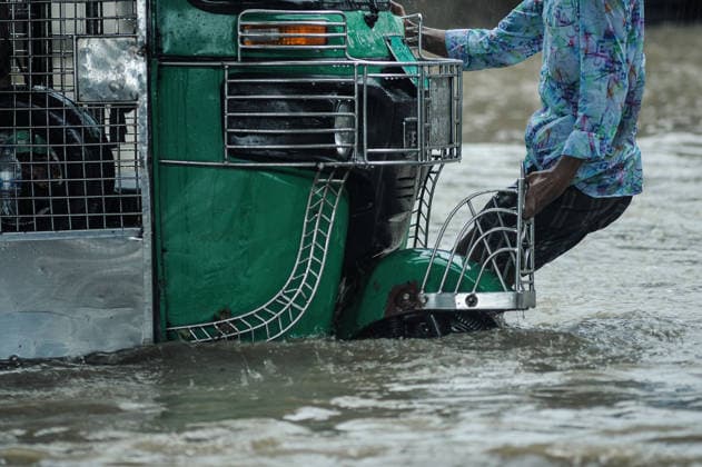 July 7, 2026: Chattogram, Bangladesh - A Cng strucked in a waterlogged street in the Bahaddarhat area of Chattogram on Tuesday, continuing three consecutive days of heavy rainfall. The persistent downpours triggered severe waterlogging across several parts of the port city, submerging roads, disrupting traffic, and causing widespread inconvenience to residents. - ZUMAr143 20260707_zap_r143_016 Copyright: xMdxRafayatxHaquexKhanx