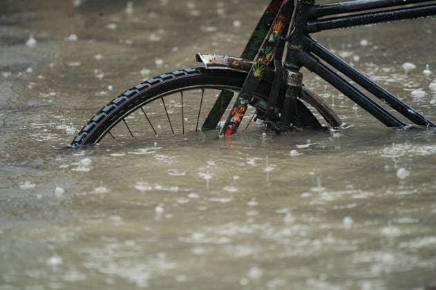 July 7, 2026: Chattogram, Bangladesh - A Rickshaw pullers navigate a waterlogged street in the Bahaddarhat area of Chattogram on Tuesday, continuing three consecutive days of heavy rainfall. The persistent downpours triggered severe waterlogging across several parts of the port city, submerging roads, disrupting traffic, and causing widespread inconvenience to residents. - ZUMAr143 20260707_zap_r143_027 Copyright: xMdxRafayatxHaquexKhanx