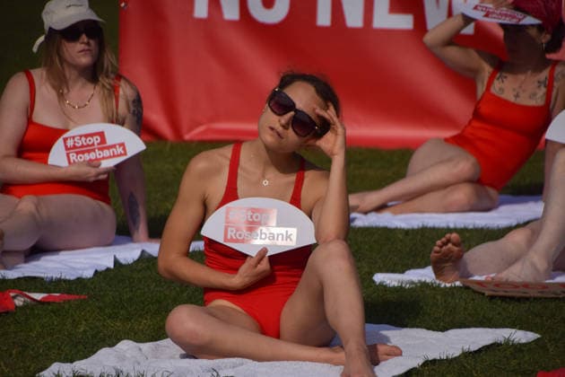 July 7, 2026, London, England, United Kingdom: Climate activists from the group Fossil Free London don swimming costumes and stage a Ã¢â‚¬Ëœsunbathe-inÃ¢â‚¬â ¢ protest dubbed Roast Against Rosebank in Parliament Square calling on the government to stop new North Sea oil and gas projects, as another heatwave hits the UK. London United Kingdom - ZUMAv130 20260707_zip_v130_032 Copyright: xVukxValcicx