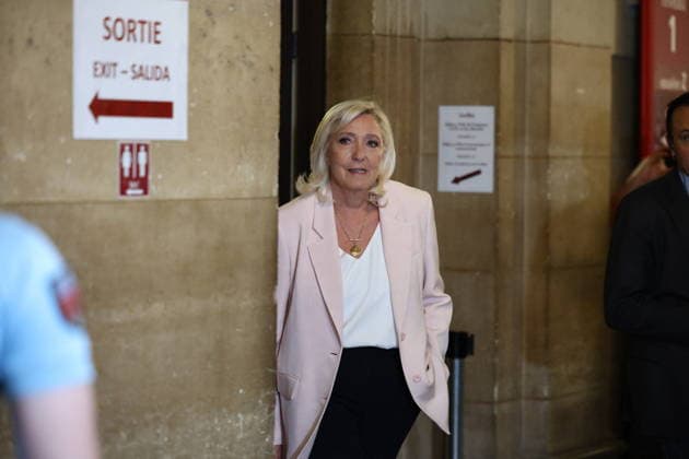 Marine Le Pen Appeal Trial Decision - Paris Marine Le Pen arriving at Paris courthouse before the decision on the appeal trial of President of the parliamentary group of the French far-right Rassemblement National (RN) party, Marine Le Pen and officials of French far-right Rassemblement National (RN) party on suspicion of embezzlement of European public funds, in Paris on July 7, 2026. The appeal comes after a court last year barred Le Pen from running for office for five years over a European Parliament fake-jobs scam involving her and other officials from her National Rally party. Photo by Raphael Lagargue ABACAPRESS.COM Paris France  Copyright: xLafarguexRaphael ABACAx