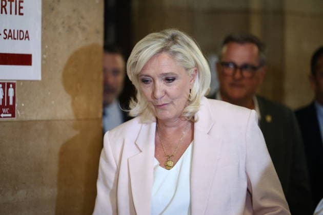 Marine Le Pen Appeal Trial Decision - Paris Marine Le Pen arriving at Paris courthouse before the decision on the appeal trial of President of the parliamentary group of the French far-right Rassemblement National (RN) party, Marine Le Pen and officials of French far-right Rassemblement National (RN) party on suspicion of embezzlement of European public funds, in Paris on July 7, 2026. The appeal comes after a court last year barred Le Pen from running for office for five years over a European Parliament fake-jobs scam involving her and other officials from her National Rally party. Photo by Raphael Lagargue ABACAPRESS.COM Paris France  Copyright: xLafarguexRaphael ABACAx