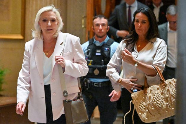 Marine Le Pen, president of the National Rally, accompanied by Member of the European Parliament Catherine Griset, leaves the Paris Court of Appeals, France, on July 7, 2026, following the verdict in the appeal trial of former and current RN members accused of embezzling European public funds in a case involving the creation of fictitious jobs at the European Parliament. The Court of Appeals sentenced Marine Le Pen, leader of the French far right, to one year of house arrest with an electronic ankle monitor in connection with this case, thereby jeopardizing her presidential candidacy next April. She was also barred from running for office for 15 months, a ban that was set to expire this year. Christian Liewig Bestimage President of the Ras  Copyright: xChristianxLiewigx xBestimagexChristianxLiewigx xBestimagex