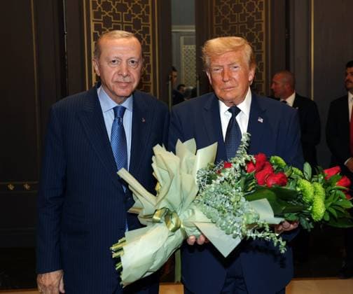 US President Donald Trump is greeted by Turkish President Recep Tayyip Erdogan, left, upon arriving for the NATO summit in Ankara, Turkey, Tuesday, July 7, 2026. (Turkish Presidency Pool - Depo Photos) 19155678