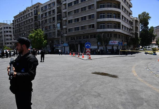 (260707) -- DAMASCUS, July 7, 2026 -- Security personnel cordon off the area around the blast site near the Ministry of Tourism building in central Damascus, Syria, July 7, 2026. Two explosions in central Damascus on Tuesday injured 18 people during a visit by French President Emmanuel Macron, according to Syria s Interior Ministry. (Photo by Xinhua) SYRIA-DAMASCUS-EXPLOSIONS AmmarxSafarjalani 
