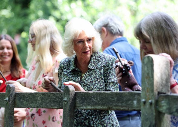 Queen Camilla Commemorates 100 Years Of Winnie The Pooh in Hartfield, UK, 07 July 2026 HARTFIELD, ENGLAND - JULY 07: Queen Camilla plays a game of ˜pooh sticks™ on ˜Poohsticks Bridge™ during her visit to Ashdown Forest to commemorate 100 Years of Winnie-the-Pooh at Ashdown Forest on July 07, 2026 in Hartfield, England. Ashdown Forest was the inspiration for the Hundred Acre Wood in A.A. Milne s classic Winnie-the-Pooh children s books. The Queen visited the forest in her role as patron of the Royal Literary Fund., Credit:Chris Jackson PA ROTA - B68 Avalon Hartfield, United Kingdom  Copyright: xChrisxJacksonx xPAxROTAx-xB68x xAvalonx 1115017902