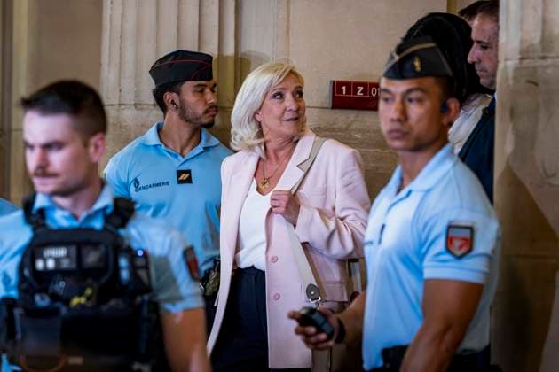 Marine Le Pen, president of the National Rally, leaves the Paris Court of Appeals, France, on July 7, 2026, following the verdict in the appeal trial of former and current RN members accused of embezzling European public funds in a case involving the creation of fictitious jobs at the European Parliament. The Court of Appeals sentenced Marine Le Pen, leader of France’s far right, to one year of house arrest with an electronic ankle monitor in connection with this case, thereby jeopardizing her presidential candidacy next April. She was also barred from running for office for 15 months, a ban that was set to expire this year. Vincenzo Armone Bestimage President of the Rassemblement National parliamentary group Marine Le Pen leaves after the  Copyright: xVincenzoxArnonex xBestimagexVincenzoxArnonex xBestimagex