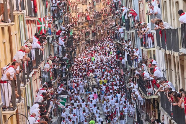 July 7, 2026, Pamplona, Navarre, Spain: People take part in the traditional encierro (bull-run) of the San Fermin Festival in Pamplona, Spain. The bull-running fiesta is held annually from 06 to 14 July in commemoration of the city s patron saint. Visitors from all over the world attend the festival. Many of them physically participate in the highlight event - the running of the bulls, or encierro - where they attempt to outrun the animals along a route through the narrow streets of Pamplona s old city. Pamplona Spain - ZUMAa206 20260707_zsp_a206_005 Copyright: xRubenxAlbarranx