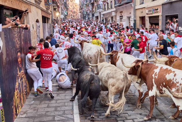 July 7, 2026, Pamplona, Navarre, Spain: People take part in the traditional encierro (bull-run) of the San Fermin Festival in Pamplona, Spain. The bull-running fiesta is held annually from 06 to 14 July in commemoration of the city s patron saint. Visitors from all over the world attend the festival. Many of them physically participate in the highlight event - the running of the bulls, or encierro - where they attempt to outrun the animals along a route through the narrow streets of Pamplona s old city. Pamplona Spain  - ZUMAa206 20260707_zsp_a206_020 Copyright: xRubenxAlbarranx