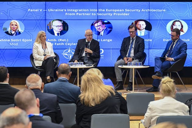 A panel on Ukraine s integration into European security held as part of the NATO Summit Dialogues ANKARA, TURKIYE - JULY 7: Albanian Atlantic Council Strategic Advisor Juxhina Sotiri Gjoni (L), former Turkish Permanent Representative to NATO and ATA Turkiye President Ambassador Mehmet Fatih Ceylan (2nd L), Munich Security Conference (MSC) Senior Fellow Nico Lange (2nd R) and Ukrainian Member of Parliament Oleg Dunda (R) attend a panel titled Ukraine s Integration into the European Security Architecture: From Partner to Security Provider during the NATO Summit Dialogues event organized by the Turkish Atlantic Council (ATA Turkiye) and Hariciye Center for Foreign Policy and Security Studies in Ankara, Turkiye, on July 7, 2026. Fatma Nur A  Copyright: x2026xAnadoluxFatmaxNurxArslanx